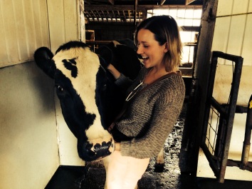 This is me with a cow who makes 60L of milk a day, let's give her a round of applause.